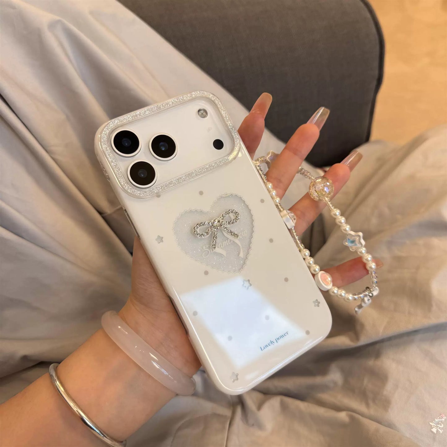PulseCase™ Pearl Bow iPhone Case – Luxury Heart Charm Design