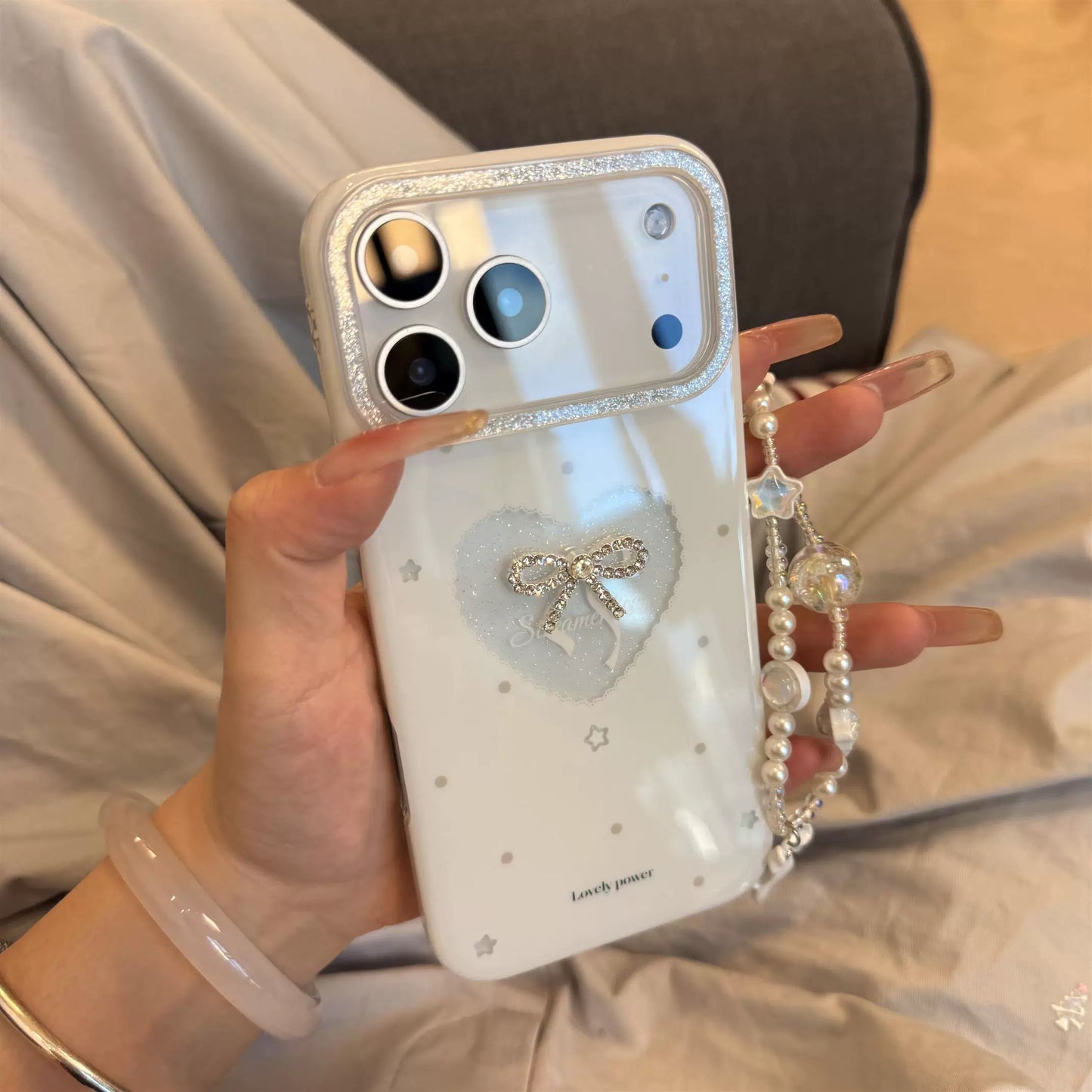 PulseCase™ Pearl Bow iPhone Case – Luxury Heart Charm Design