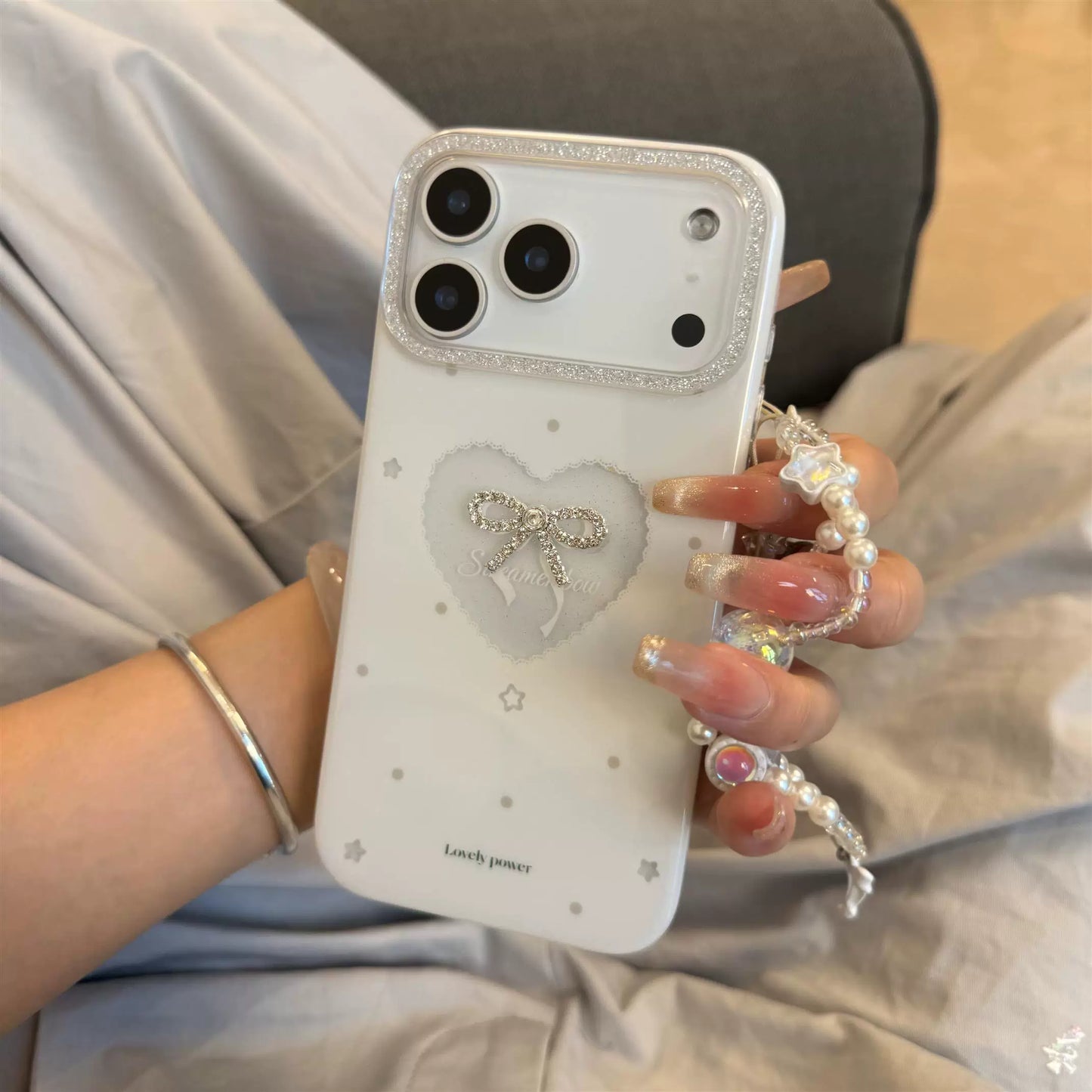 PulseCase™ Pearl Bow iPhone Case – Luxury Heart Charm Design